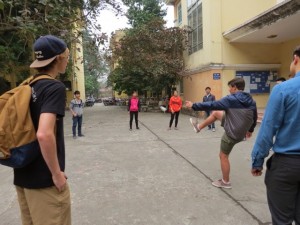  Senior Pedro Gallardo and junior Mitchell Capp joined some university students for a game of their local version of hacky sack.